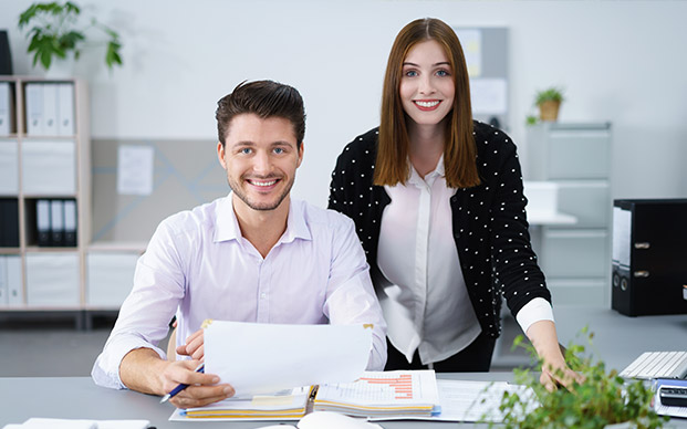 Happy couple doing paperwork