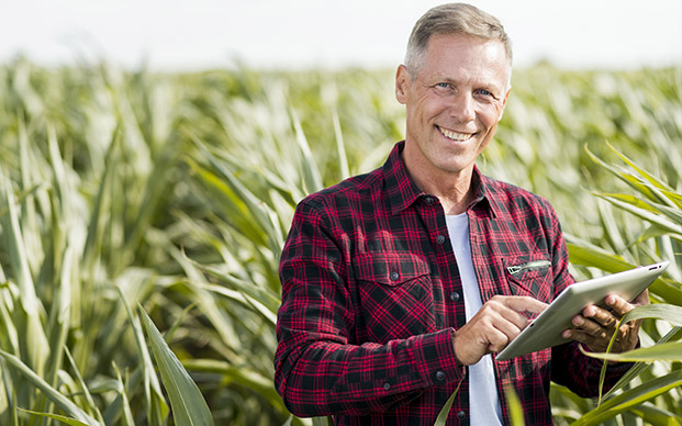 Happy farmer in field