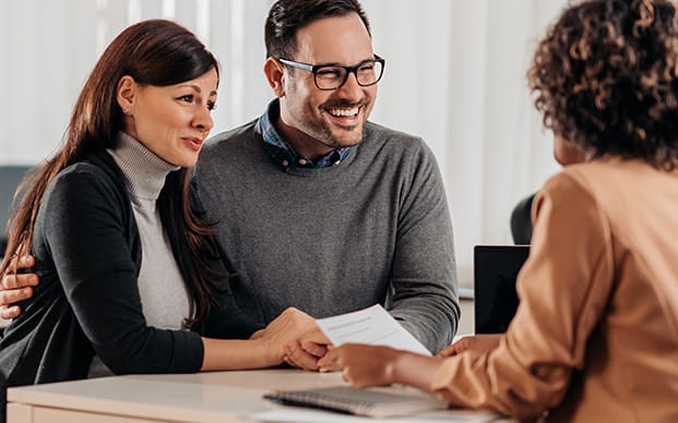 couple speaking with banker